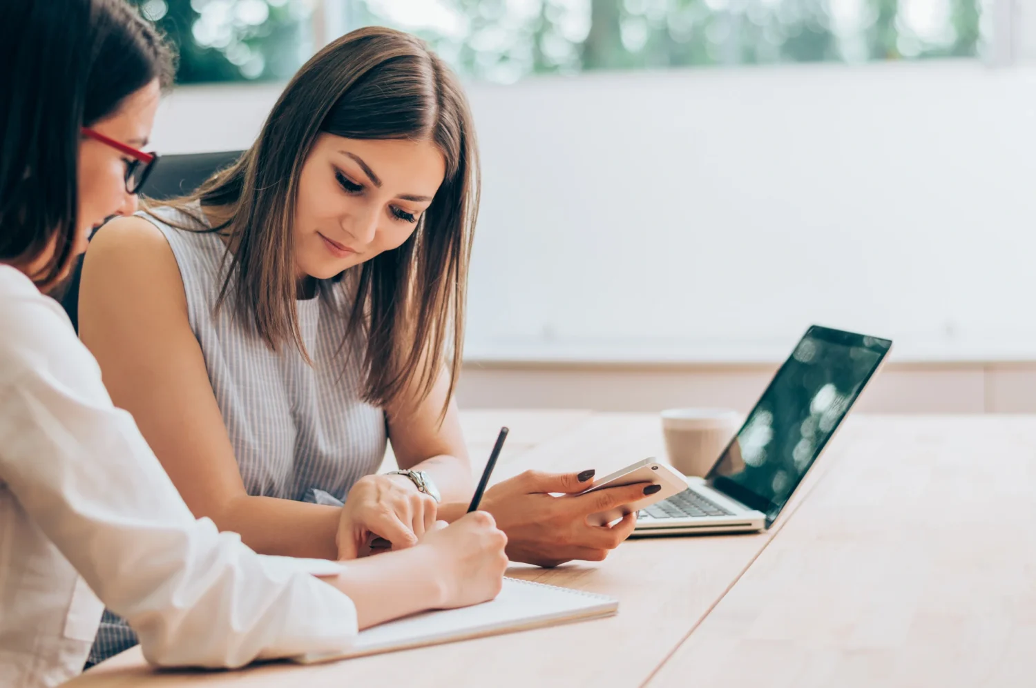 two women write essay